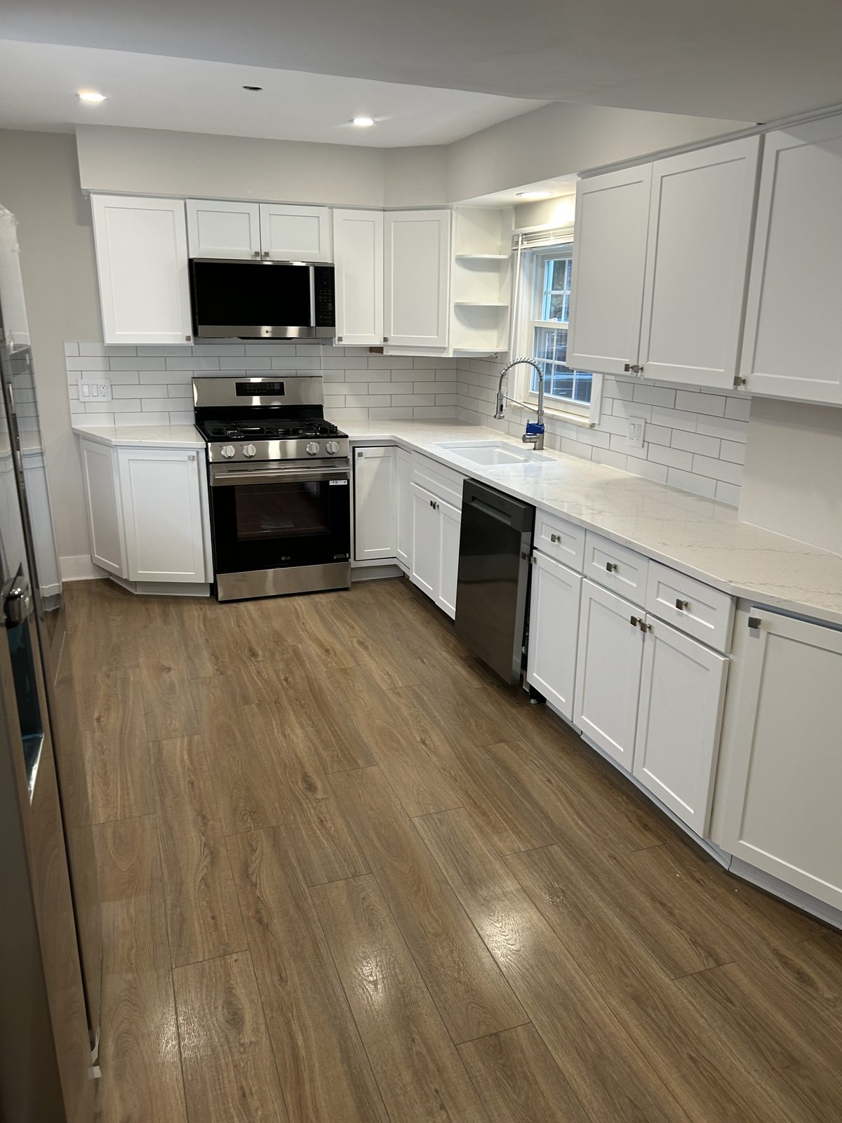 A bright white kitchen fully reset by BTI Clean